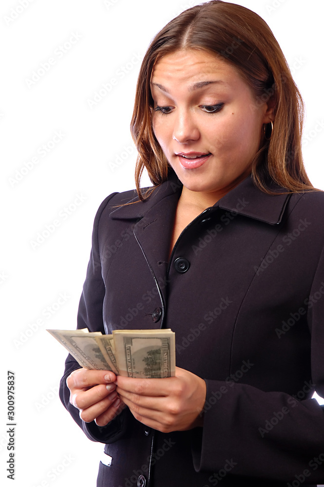 A young woman with dollars in her hands, isolated on white background A young woman with dollars in her hands, isolated on white background