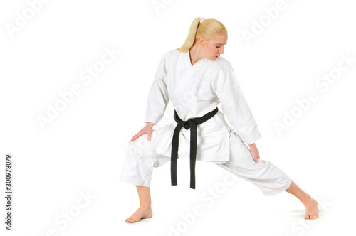 Girl blonde karate sportswoman in a kimono