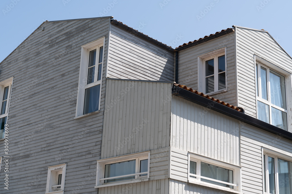 Facade with windows of modern wooden house Facade with windows of modern wooden house