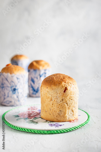 Homemade Easter cakes in paper wrapper. Light background