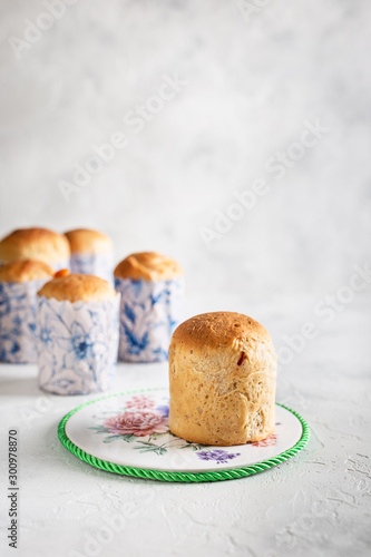 Homemade Easter cakes in paper wrapper. Light background