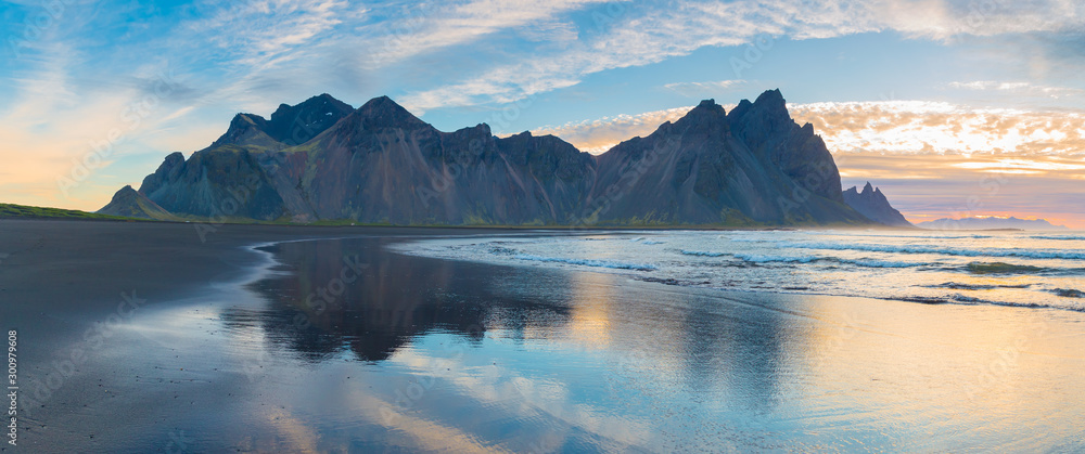 Reflection of Vestrahorn (Batman) mountain in the water at high tide. Colorfur morning scene of Stokksnes headland. Southeastern Iceland, Europe. Visit Iceland. Beauty world.