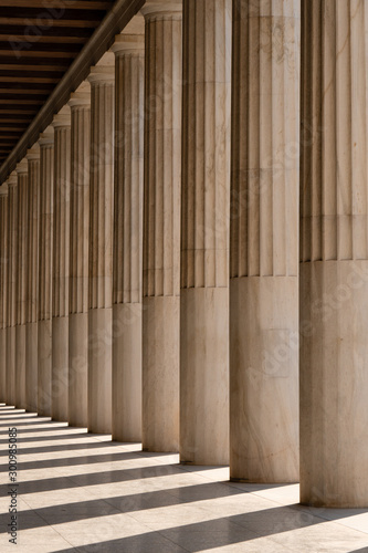 Row of ancient Greek columns in Athens. Architectural abstract.