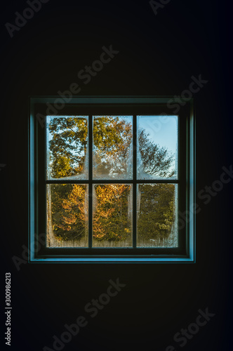 Window seen from inside the house on a autumn cold day