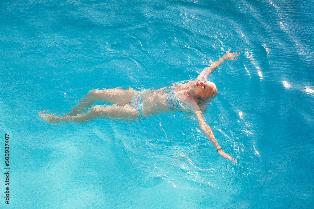 Blonde near a swimming pool in Cyprus