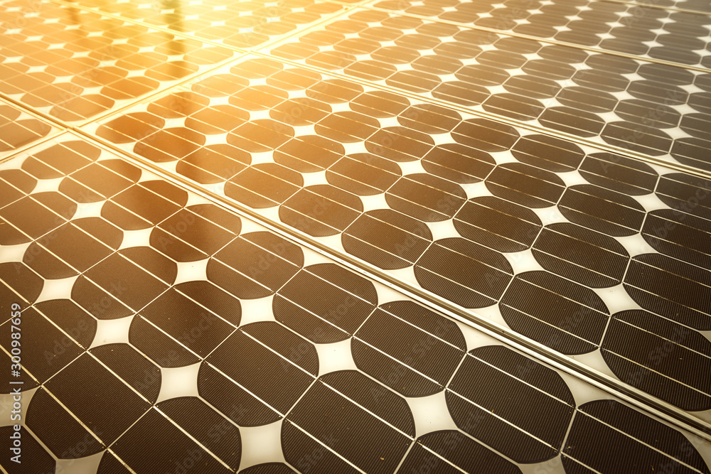 Obraz premium Solar energy panel photovoltaics module with sunlight reflection