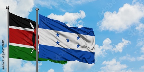 Kenya and Honduras flag waving in the wind against white cloudy blue sky together. Diplomacy concept, international relations.