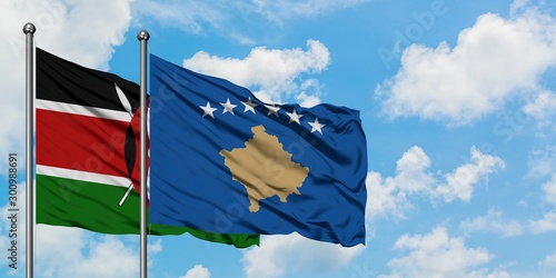 Kenya and Kosovo flag waving in the wind against white cloudy blue sky together. Diplomacy concept, international relations.