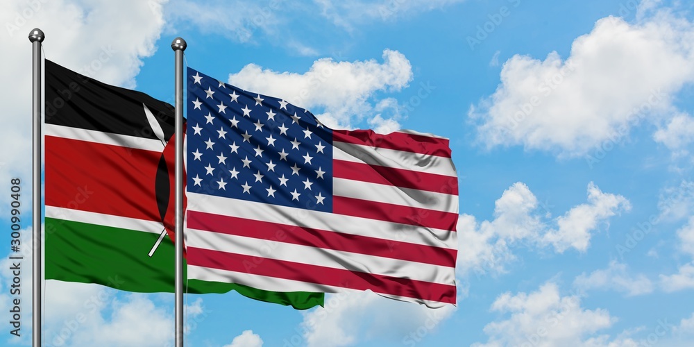 Obraz premium Kenya and United States flag waving in the wind against white cloudy blue sky together. Diplomacy concept, international relations.