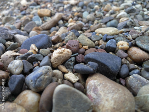 a scattering of colored pebbles of different sizes