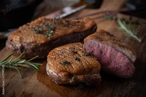 grilled duck breast meat with skillet photo