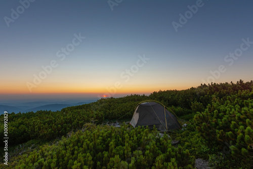 Beautiful summer in the Carpathian Mountains with tourists in tents with beautiful views ..