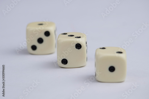 White dice with black dots in white background