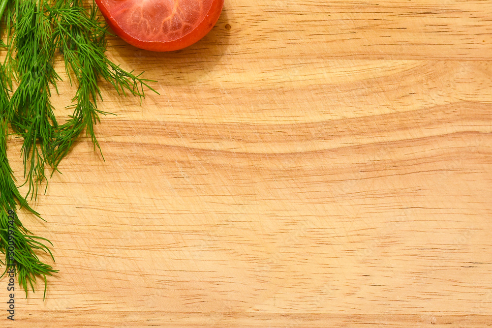 wooden cutting board with dill and tomatoes wooden cutting board with dill and tomatoes