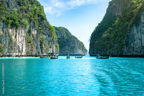 Travel vacation background - Thai traditional longtail boats on the sea at Phi-Phi island, Thailand
