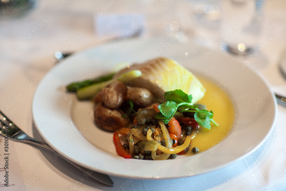 Cooked fish with potatoes and vegetables Cooked fish with potatoes and vegetables