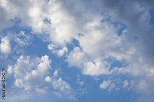 Amazing dark grey and white clouds during the sunset contrasted against a lighter color sky