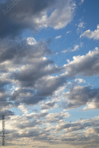 Amazing dark grey and white clouds during the sunset contrasted against a lighter color sky