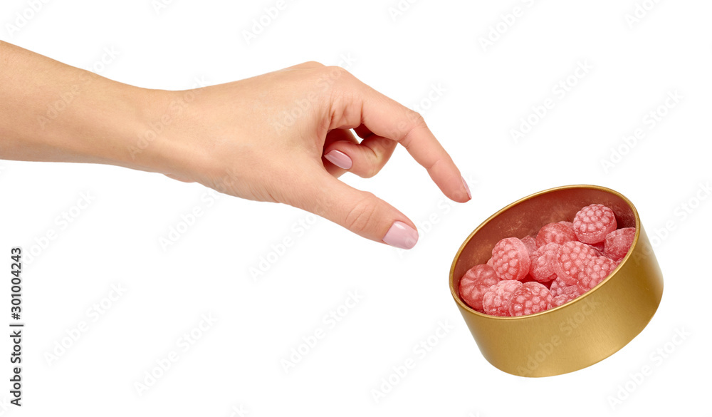 Pink raspberry candies in metal box. Delicious fruit caramel sweets in container. Pink raspberry candies in metal box. Delicious fruit caramel sweets in container.