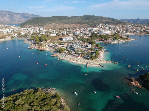 Beautiful Ionian Sea near Ksamil and Sarande with clear turquoise water, piers, aerial view from drone (Ksamil, Albania)