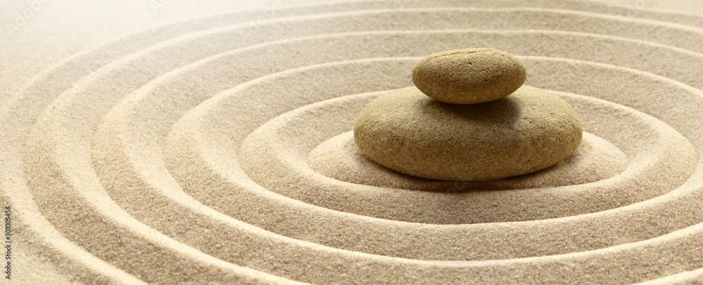 zen garden meditation stone background with stones and lines in sand for relaxation balance and harmony spirituality or spa wellness - obrazy, fototapety, plakaty 