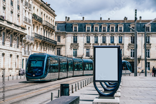 Fototapeta Naklejka Na Ścianę i Meble -  Line of clear billboards on city street with blank copy space screen for advertising or promotional poster content, empty mockup Lightboxes for information, blank displays outdoors in urban area