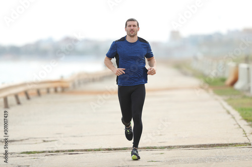 Runner training running towards camera photo