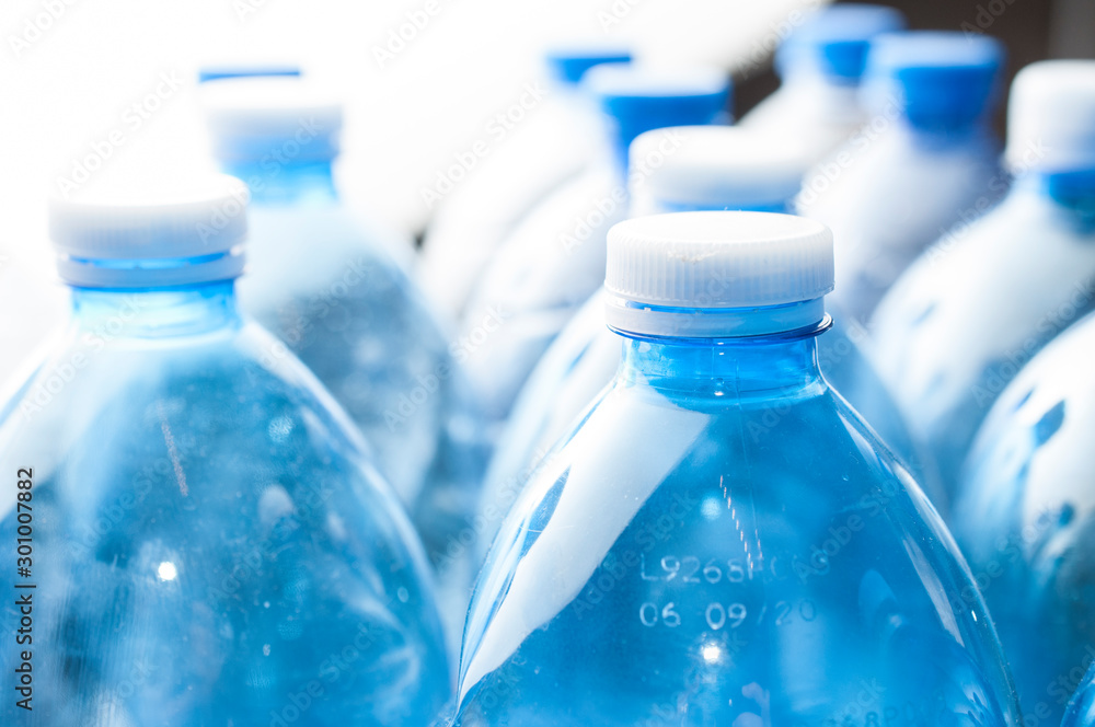 Recycling concept: empty blue water plastic bottle on white background Recycling concept: empty blue water plastic bottle on white background