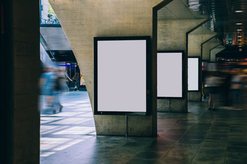 Clear Billboard in public place with blank copy space screen for advertising or promotional poster content, empty mock up Lightbox for information, blank display in station area with daylight