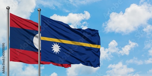 Laos and Nauru flag waving in the wind against white cloudy blue sky together. Diplomacy concept, international relations.