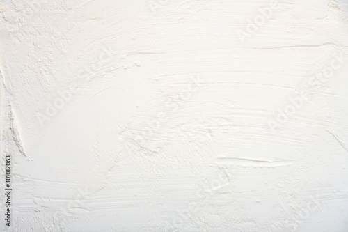 White textured background. Plaster. A place for a label.