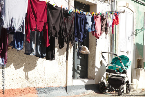 NB__7743 Clothes drying on ropes in front of house photo