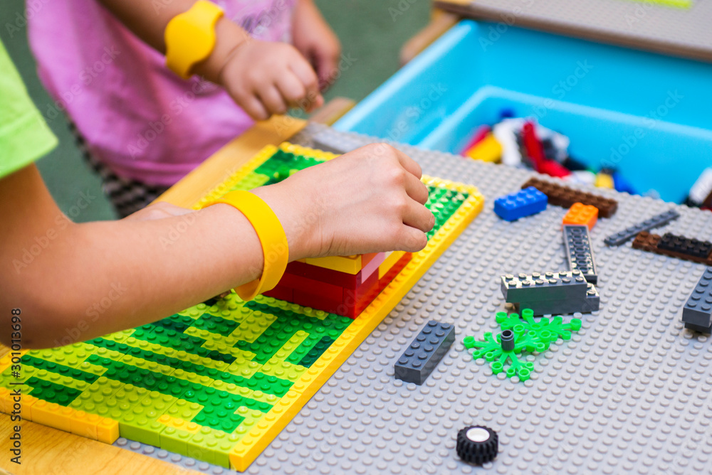 The child collects the designer. Kids activity in kindergarten or at home The child collects the designer. Kids activity in kindergarten or at home