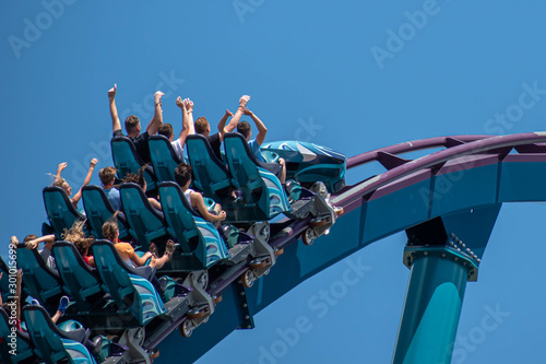 People enjoying riding amazing rollercoaster during summer vacation 4.