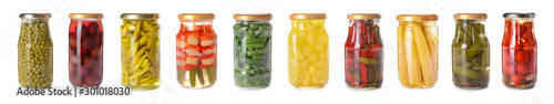 Fotografia Jars with different canned vegetables on white background