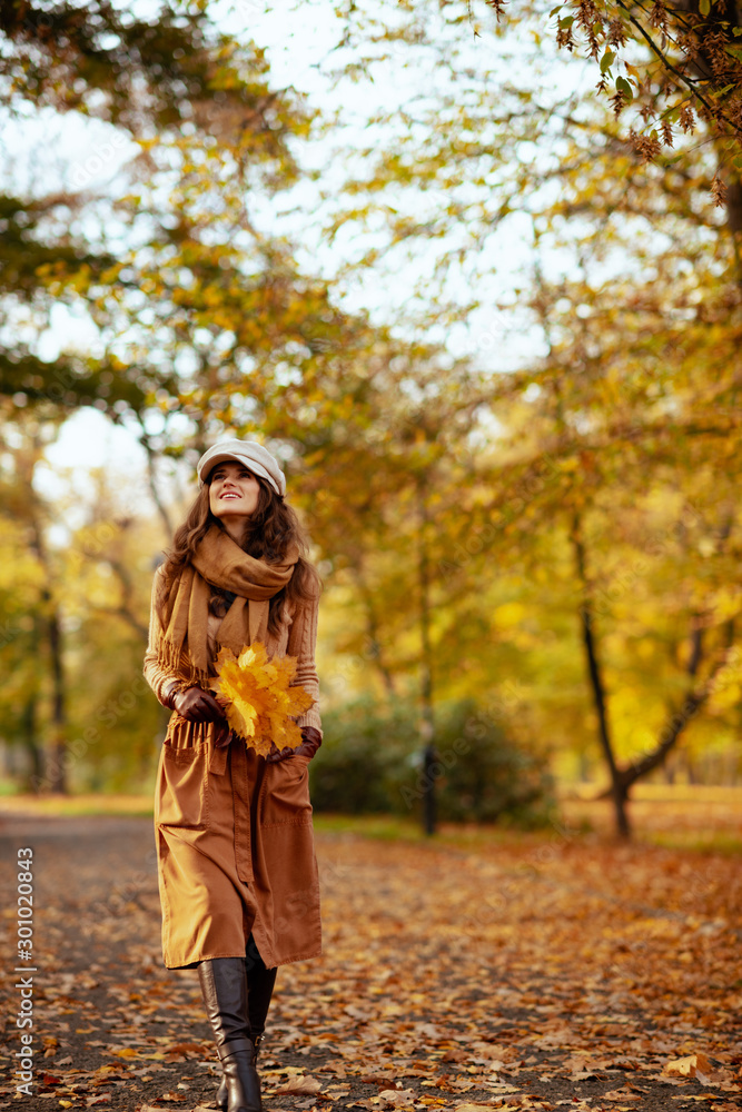 woman with yellow leaves walking outdoors in autumn park woman with yellow leaves walking outdoors in autumn park