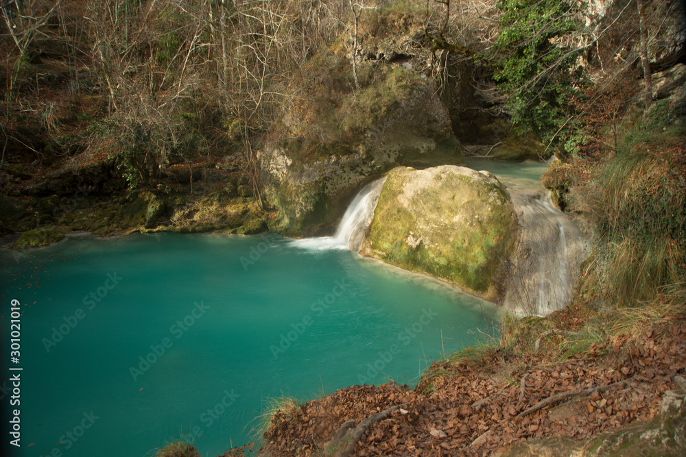 Turquoise water pond in Urederra River, Navarra Turquoise water pond in Urederra River, Navarra