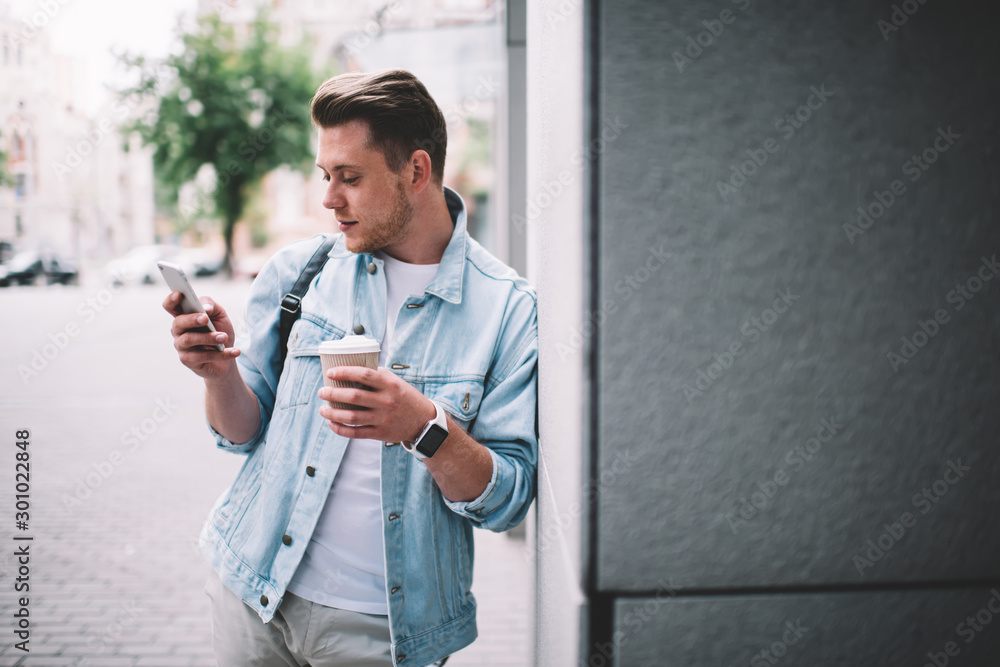 Contemporary man using phone on street Contemporary man using phone on street