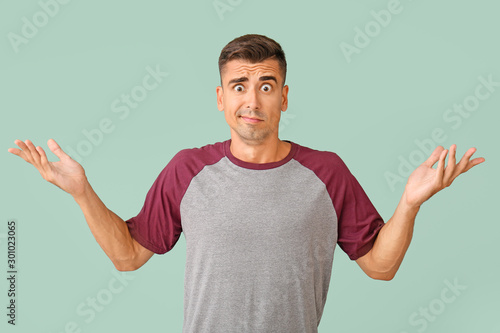 Surprised young man on colo...