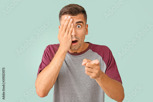 Surprised young man on colo...