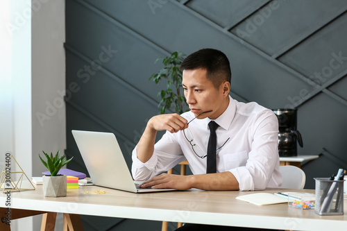 Asian businessman working o...