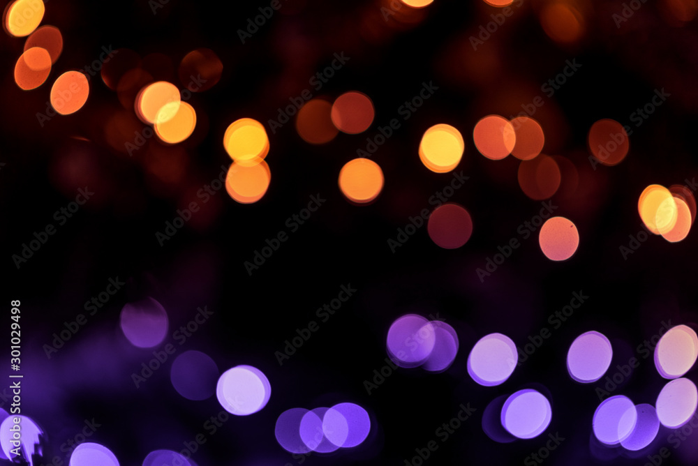 Fototapeta premium Multi-colored bokeh on a dark background. Abstraction