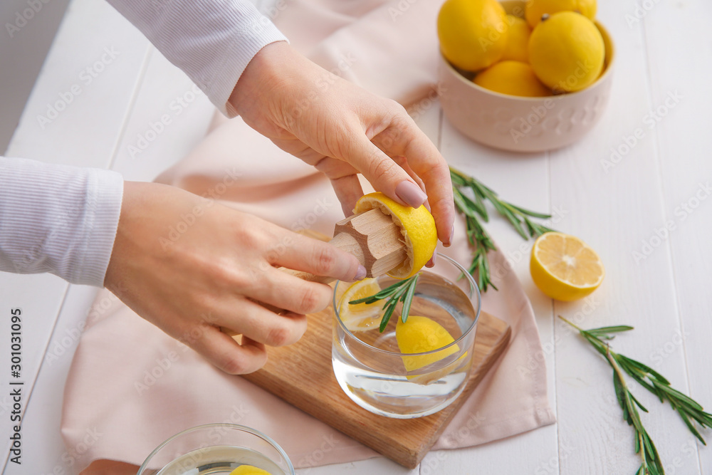 Woman making fresh lemonade in kitchen Woman making fresh lemonade in kitchen
