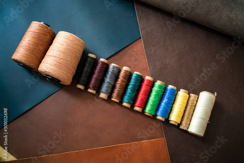 colorful linin thread on geuine leather craftmanship working photo