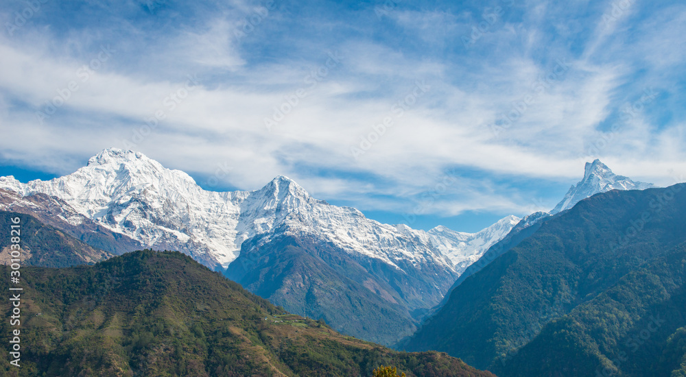 View of Annapurna range includes Annapurna South (left) - Himchuli (centre) and Machapuchare (far right) view from Ghandruk village in northern-central of Nepal.