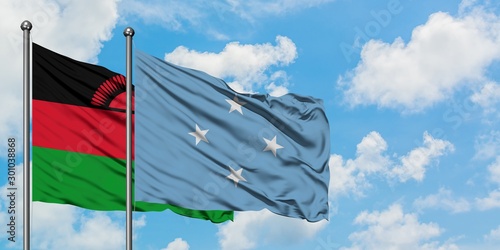 Malawi and Micronesia flag waving in the wind against white cloudy blue sky together. Diplomacy concept, international relations.