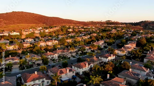 Aerial view of residential modern subdivision luxury house neighborhood during sunset. South California, USA