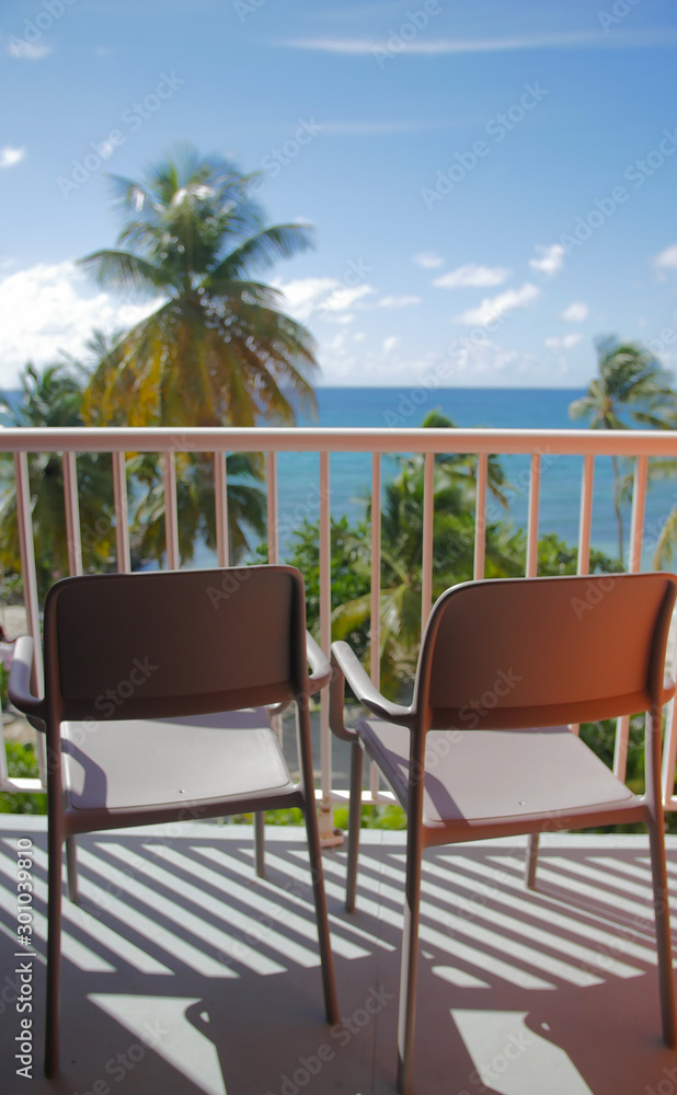 Two chairs with sea view from a balcony