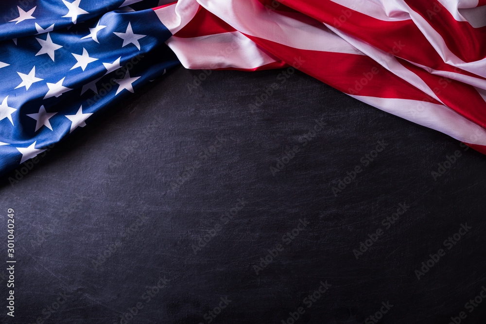 Happy Veterans Day. American flags veterans against a blackboard background. Happy Veterans Day. American flags veterans against a blackboard background.