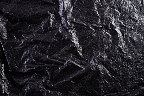 Top view of Black plastic bag texture and background. Reduction of plastic bags for natural treatment. Recycle and World Environment Day concept.